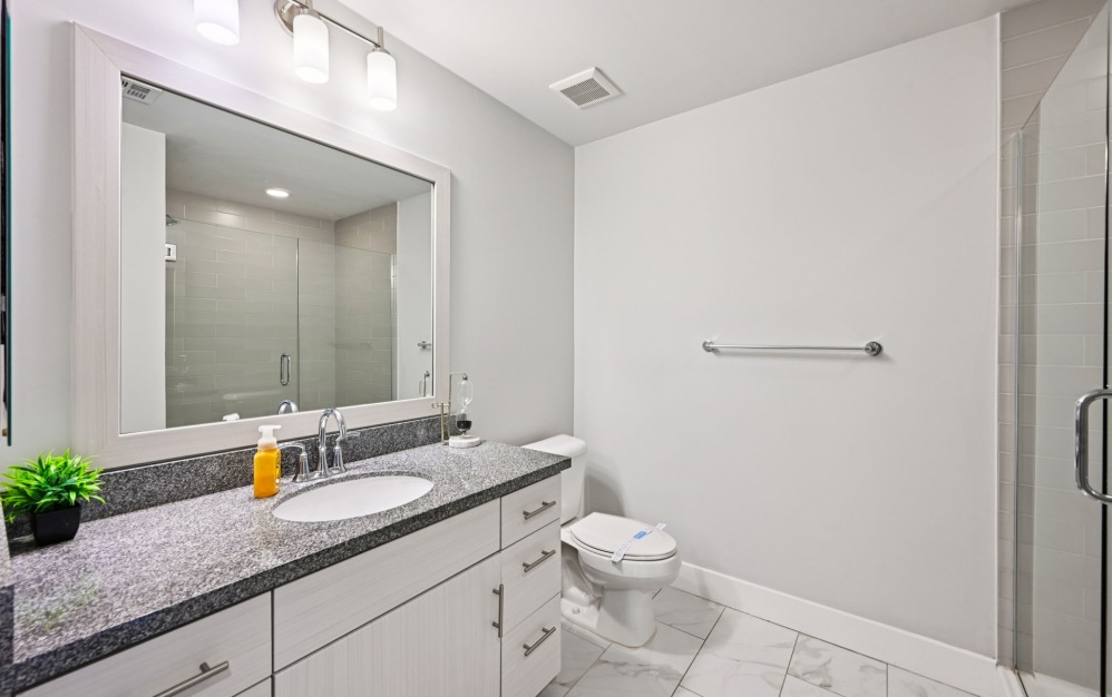 Spacious countertop space inside apartment bathrooms at Arts District 