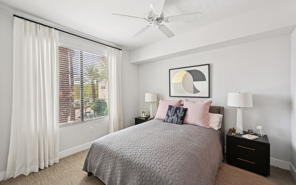 Large windows inside apartment bedrooms bringing in ample natural lighting at Arts District