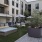 Private cabanas near the community pool outside of Arts District Apartments