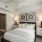 elegantly furnished apartment bedroom with access to a private bath